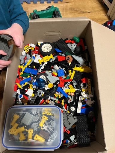 Moving box full of random Lego pieces