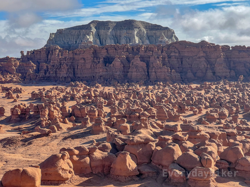 A large field of hoodoos gives way to a large, eroding wall of hoodoos-to-be, which is followed by an even larger stone uprising. This photo demonstrates the evolution of the hoodoos in the area.